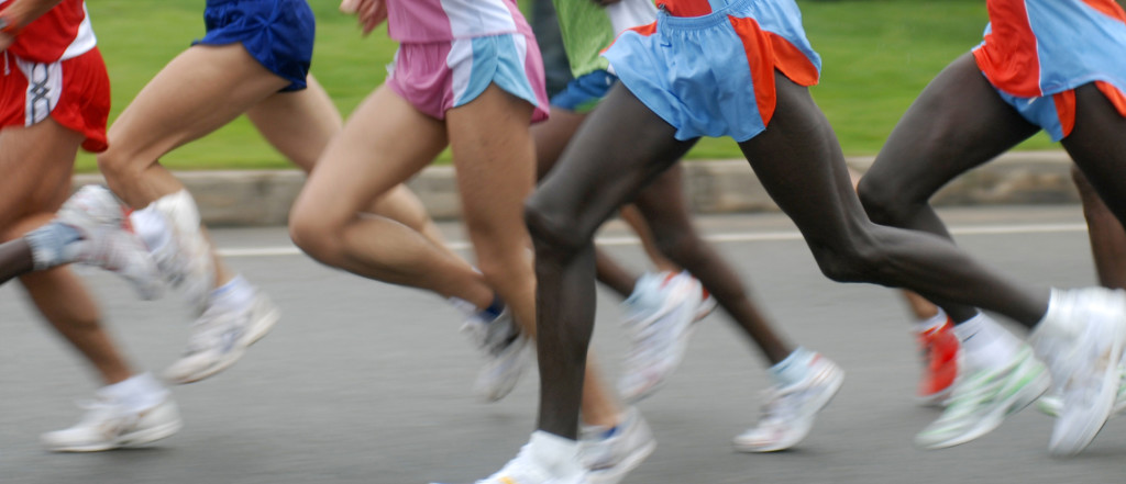 Black and yellow race of people running